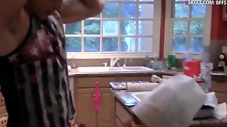 Two teens shared a cock in the kitchen