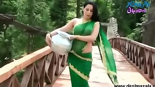 Roopi Shah Paki slut deprived of blouse - nipple showing in wet saree- Desimasala.co